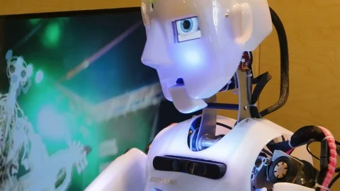 Humanoid anthropomorphic robot talking moving head and hands close up. Stock Footage 110983696