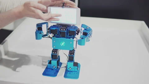 Humanoid autonomous robot with smartphone dancing Stock Footage 89408346