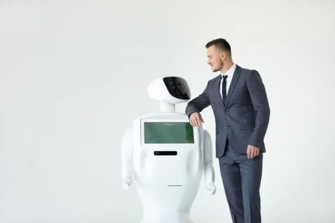 Humanoid autonomous robot with stylish man in a suit. Modern Robotic Stock Photos