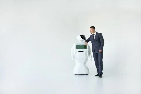 Humanoid autonomous robot with stylish man in a suit. Modern Robotic Stock Photos