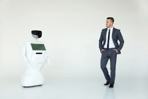 Humanoid autonomous robot with stylish man in a suit. Modern Robotic Stock Photos