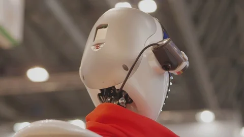 Humanoid robot with display on front side turning, nodding Stock Footage 119159641