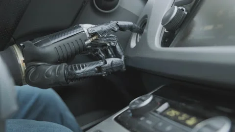 Humanoid robot driver starts or stops engine of car Stock Footage 158448568