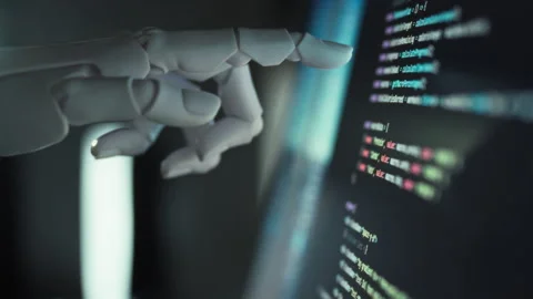 Humanoid robot efficiently performs coding tasks under guidance advanced sof Stock Footage 331475751