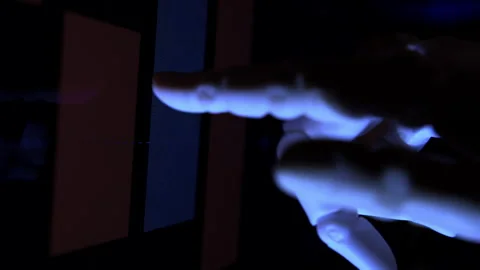 Humanoid robot hand analyzing economic charts from a computer screen Stock Footage 337962679