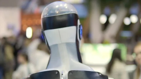 A humanoid robot is showcased at a tech expo, emphasizing innovation and AI in Stock Footage 277538035