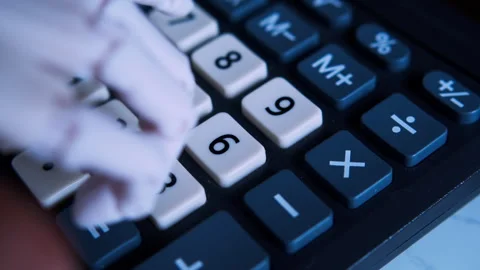Humanoid robotic hand typing on an office calculator in first-person view Stock Footage 337911805