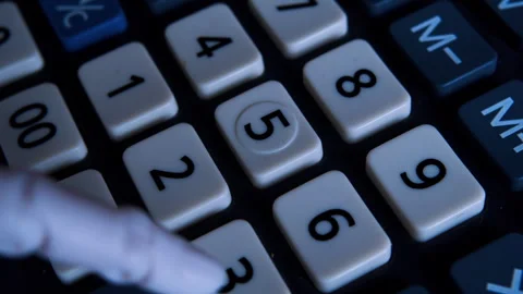 Humanoid robotic hand typing on an office calculator in first-person view. Stock Footage 337912222