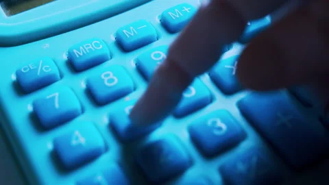 Humanoid robotic hand typing on an office calculator in first-person view. Stock Footage 337912860