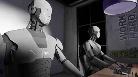 Humanoid robots working at desks with computers in modern office interior with Stock Footage 312028713