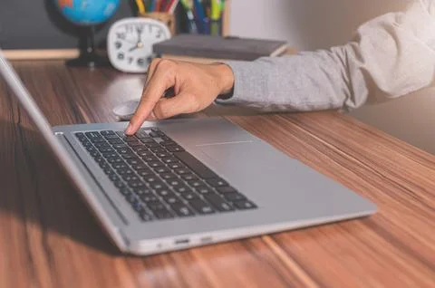 Humans use computers to work and communicate. Stock Photos