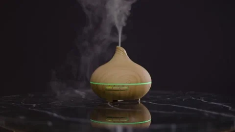 Humidifier-diffuser-bambus-reflection-on-black-table Stock Footage 149037620