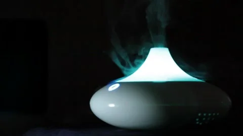 Humidifier diffusing vapour, aroma lamp, spa salon Stock Footage 56090364