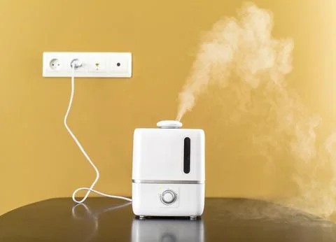 Humidifier plugged into a wall socket Stock Photos