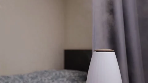 Humidify the bedroom air, ultrasonic diffuser on the table, preventing dryn.. Stock Footage 262946766