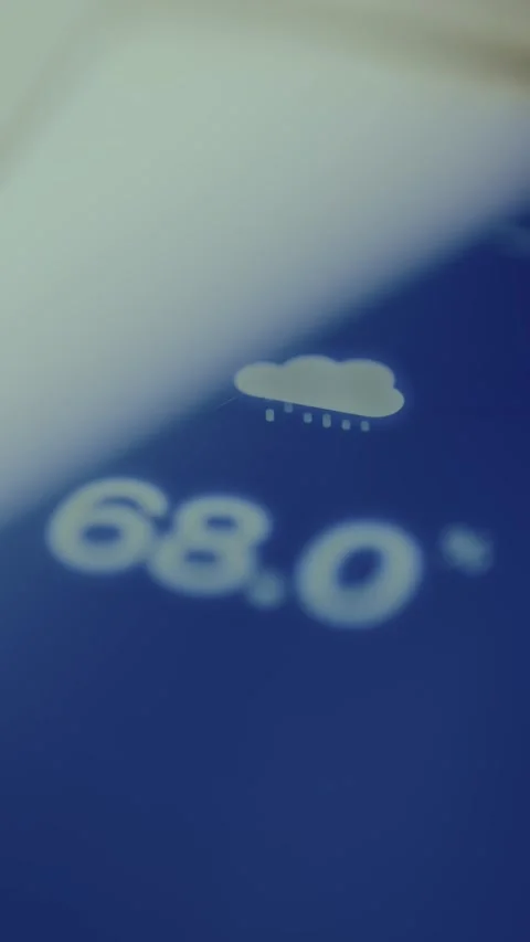 Humidity value and a small cloud icon displayed on the smartphone screen Stock Footage 326880975