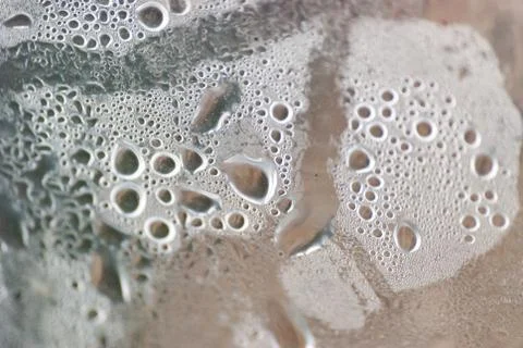 Humidity water drops macro from under the plastic material. Selective focus. Stock Photos