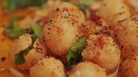 Hummus among fresh vegetables on table close-up. Hummus garnished with chickpeas Stock Footage 263087251