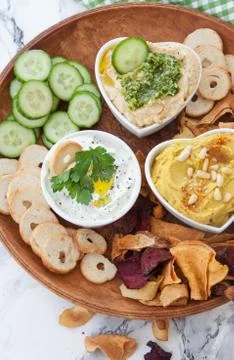 Hummus and vegetable chips Stock Photos