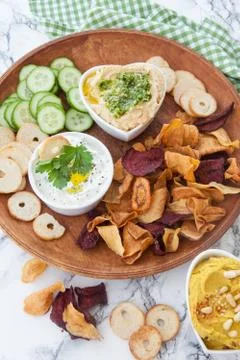 Hummus and vegetable chips Stock Photos
