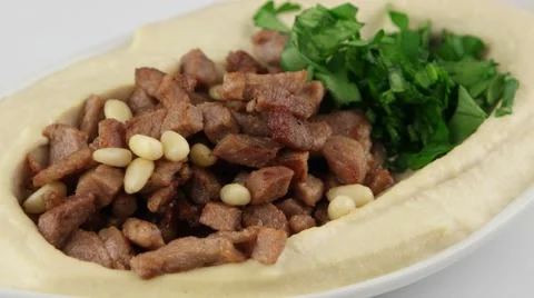 The hummus with beef meat and pine nuts (loop) Stock Footage 58005732