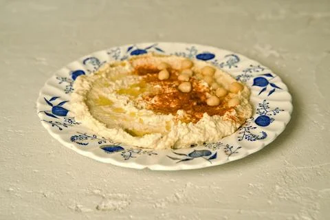 Hummus on a ceramic plate Stock Photos