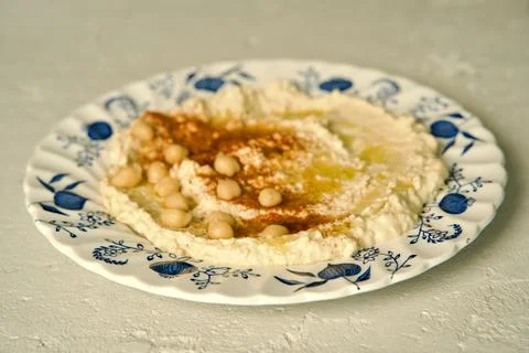 Hummus on a ceramic plate Stock Photos