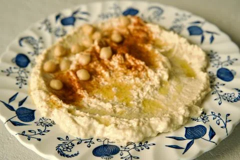 Hummus on a ceramic plate Stock Photos