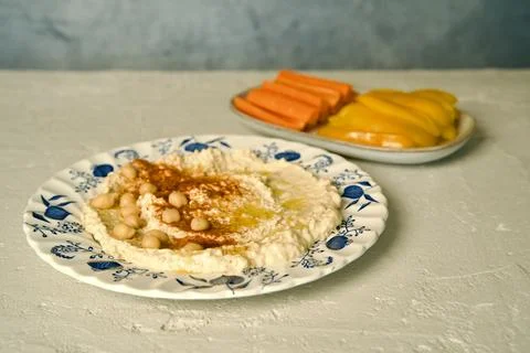 Hummus on a ceramic plate Stock Photos