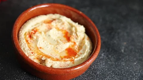 Hummus chickpea dip tasty appetizer vegetable dish fresh gourmet Stock Footage 306772199