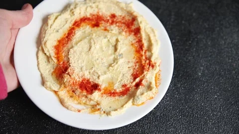 Hummus chickpea dip tasty appetizer vegetable dish fresh gourmet Stock Footage 306772200