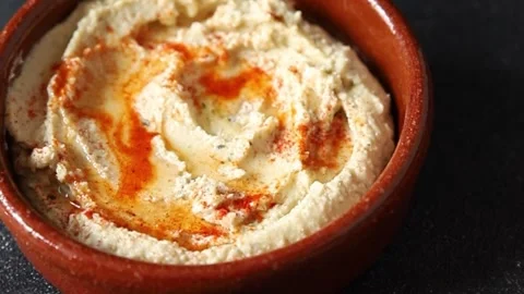 Hummus chickpea dip tasty appetizer vegetable dish fresh gourmet Stock Footage 306772201