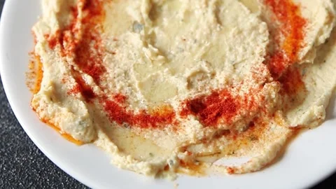 Hummus chickpea dip tasty appetizer vegetable dish fresh gourmet Stock Footage 306772202