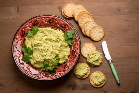 Hummus with crackers Stock Photos