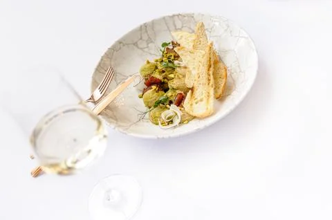 Hummus with croutons on a white background Stock Photos