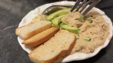 Hummus Dip with Avocado and Bread, Fork Inserting 動画素材 333130901