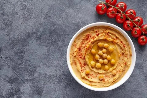 Hummus middle eastern dip paste close up with paprika, tahini, and olive oil Stock Photos