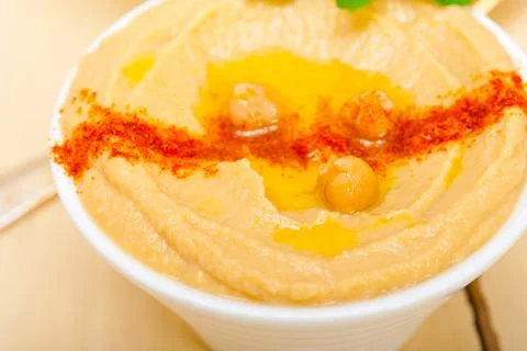 Hummus with mint on top Stock Photos