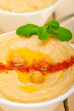 Hummus with mint on top Stock Photos