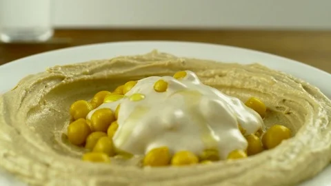 Hummus with Parsley SlowMotion2 Stock Footage 84059425