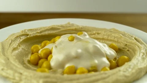Hummus with Parsley SlowMotion3 Stock Footage 84059429