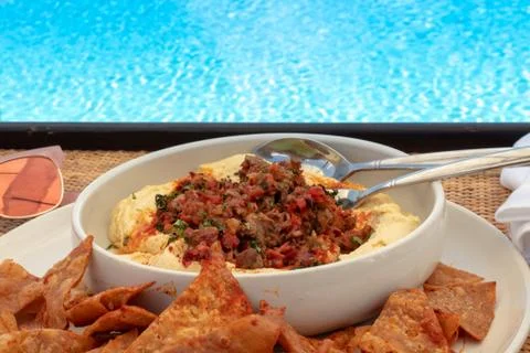 Hummus by the pool Stock Photos