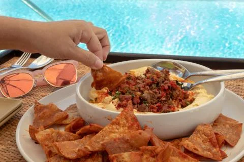 Hummus by the pool Stock Photos