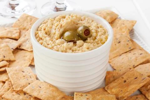 Hummus served with crackers. Stock Photos