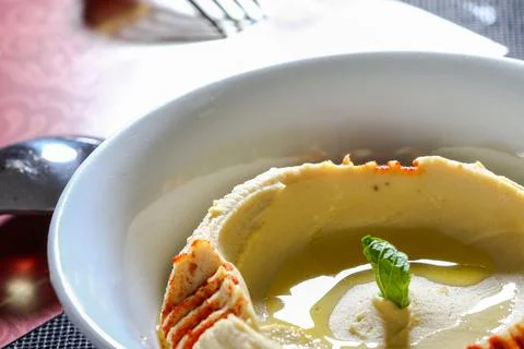 HUMMUS served in dish close up side view of arab food Stock Photos