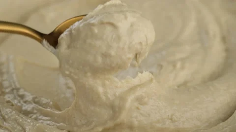 Hummus snack with golden spoon Stock Footage 166544243