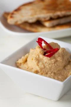 Hummus spread with pita bread Stock Photos