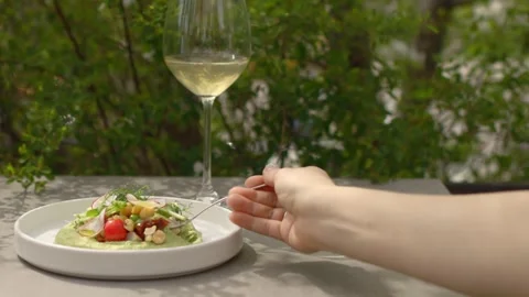 Hummus with spring vegetables on a white plate. Stock Footage 277134952