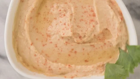 Hummus Top View Rotation On Marble Close Up Video stock 126158340
