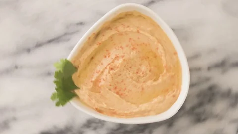 Hummus Top View Rotation On Marble Video stock 126158360